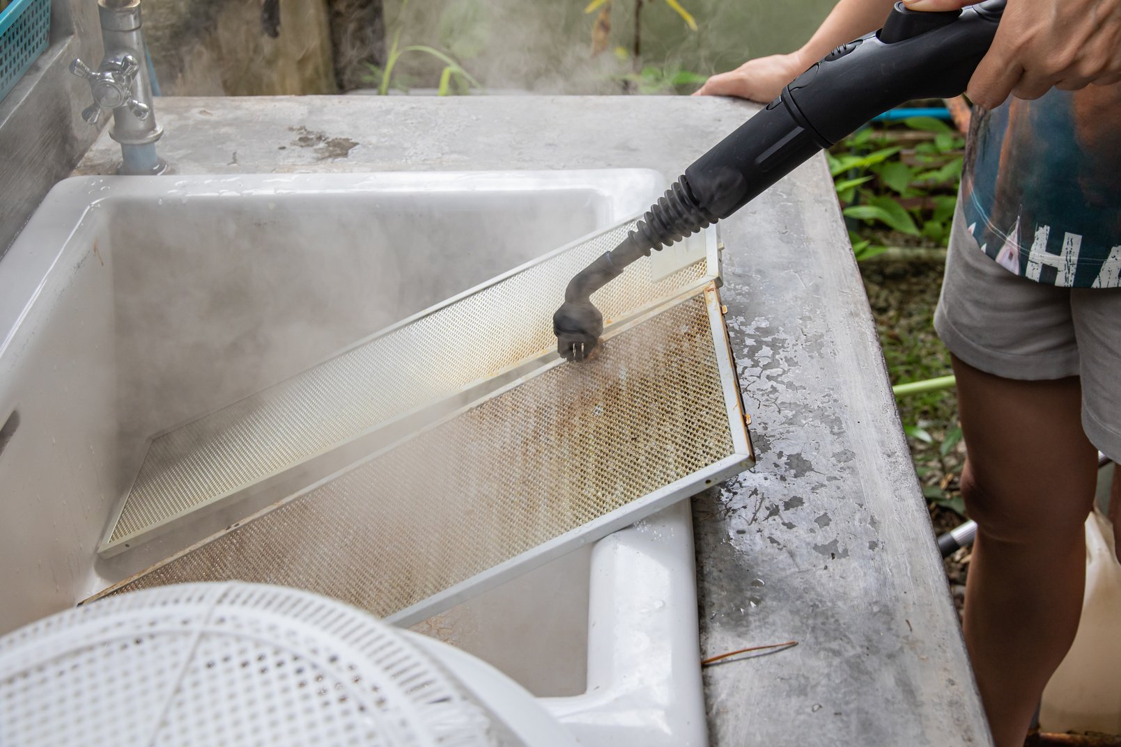 Cleaning aluminum filter for kitchen hood.